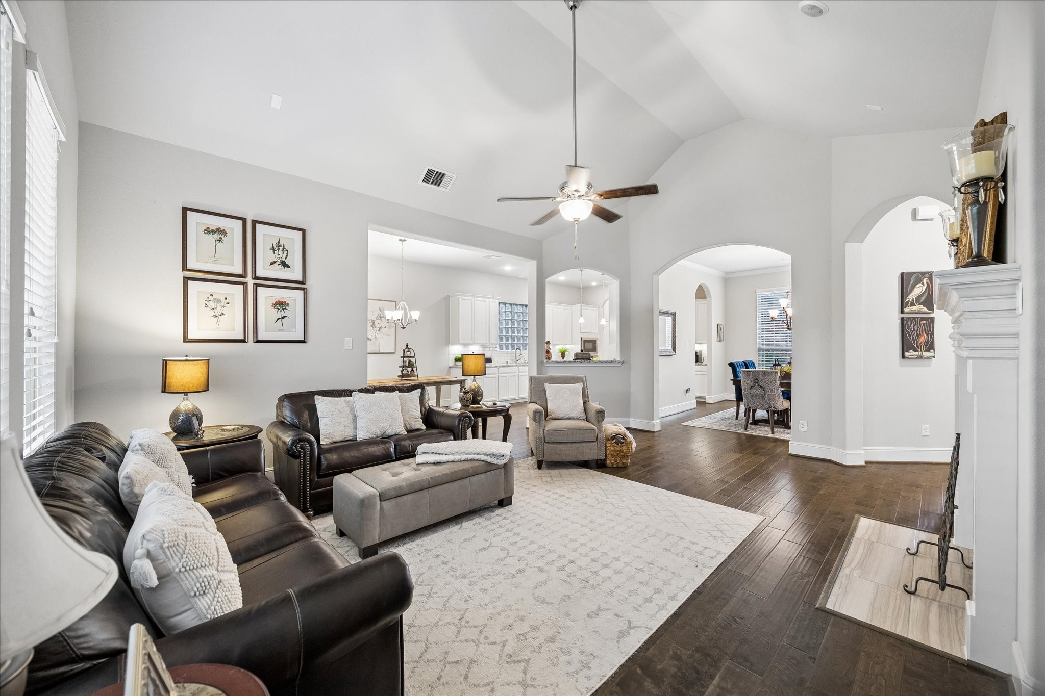 19 Peace Tree Way Tomball, TX 77375 - Photo 15 of 36 View of the spacious den with elegant hardwood floors as seen from the primary bedroom.