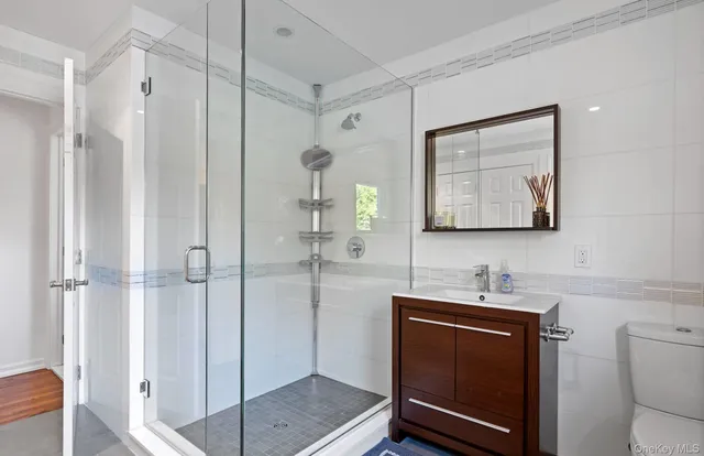 a bathroom with a toilet sink and shower