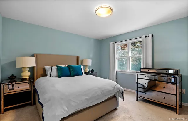 a bed room with a bed and a window