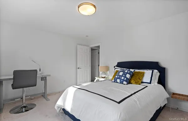 a bedroom with a bed and a chair