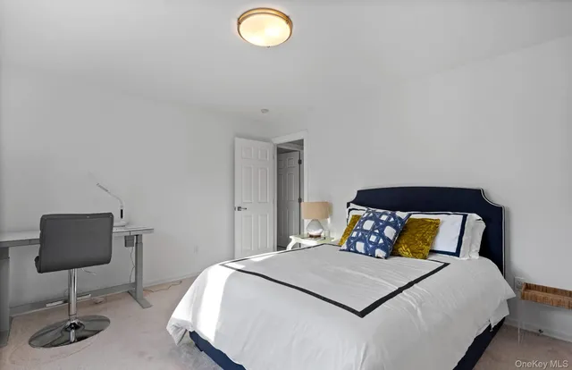 a bedroom with a bed and a chair