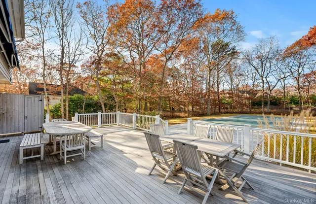a view of a chairs and table on the deck