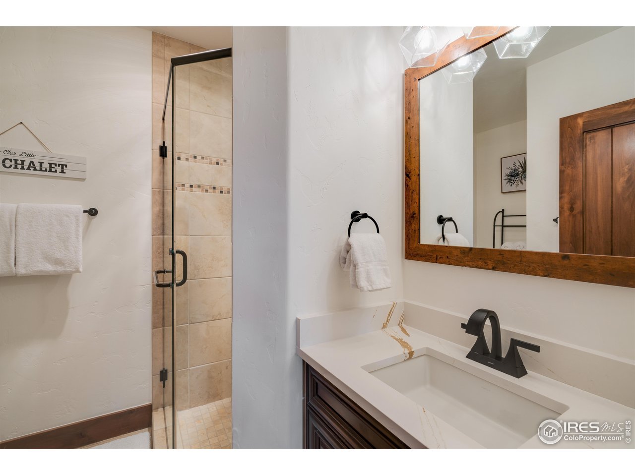 1891 Ski Hill Road, Unit 7408 Breckenridge, CO 80424 - Photo 16 of 30 a bathroom with a sink and a mirror