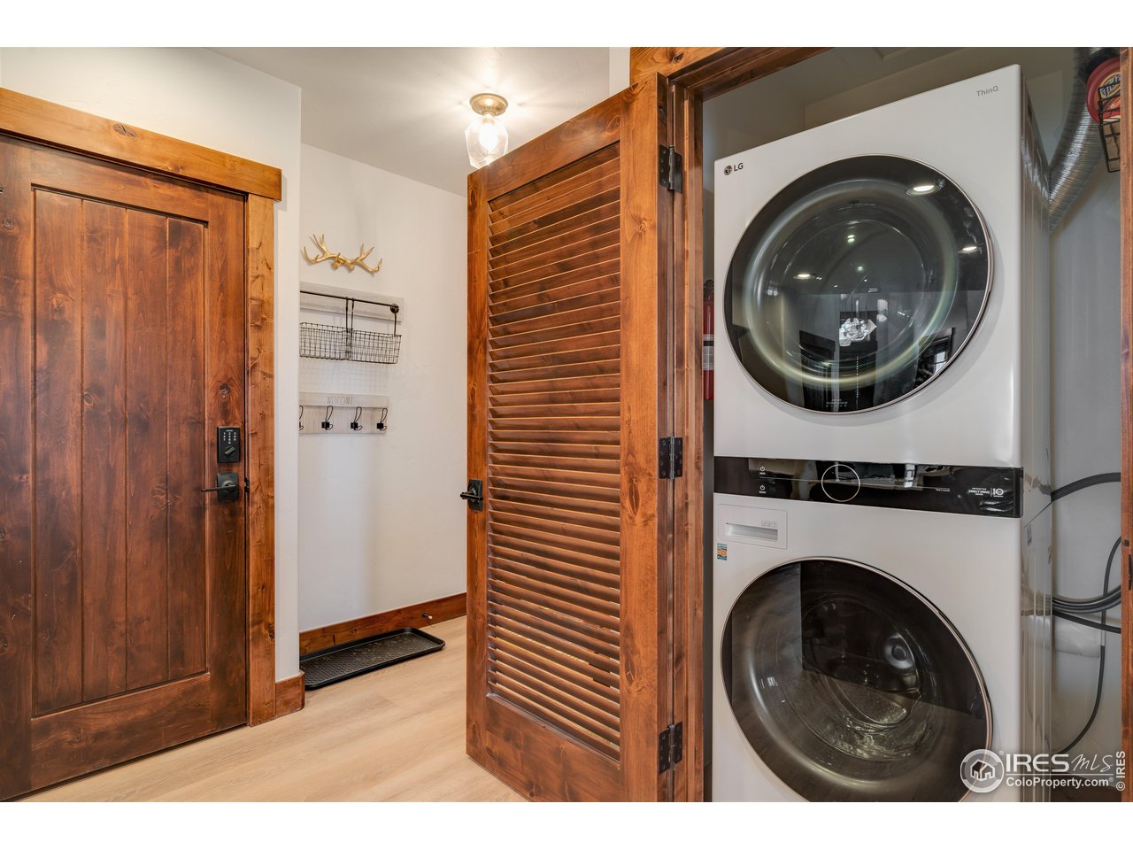 1891 Ski Hill Road, Unit 7408 Breckenridge, CO 80424 - Photo 17 of 30 a view of a hallway with washer and dryer