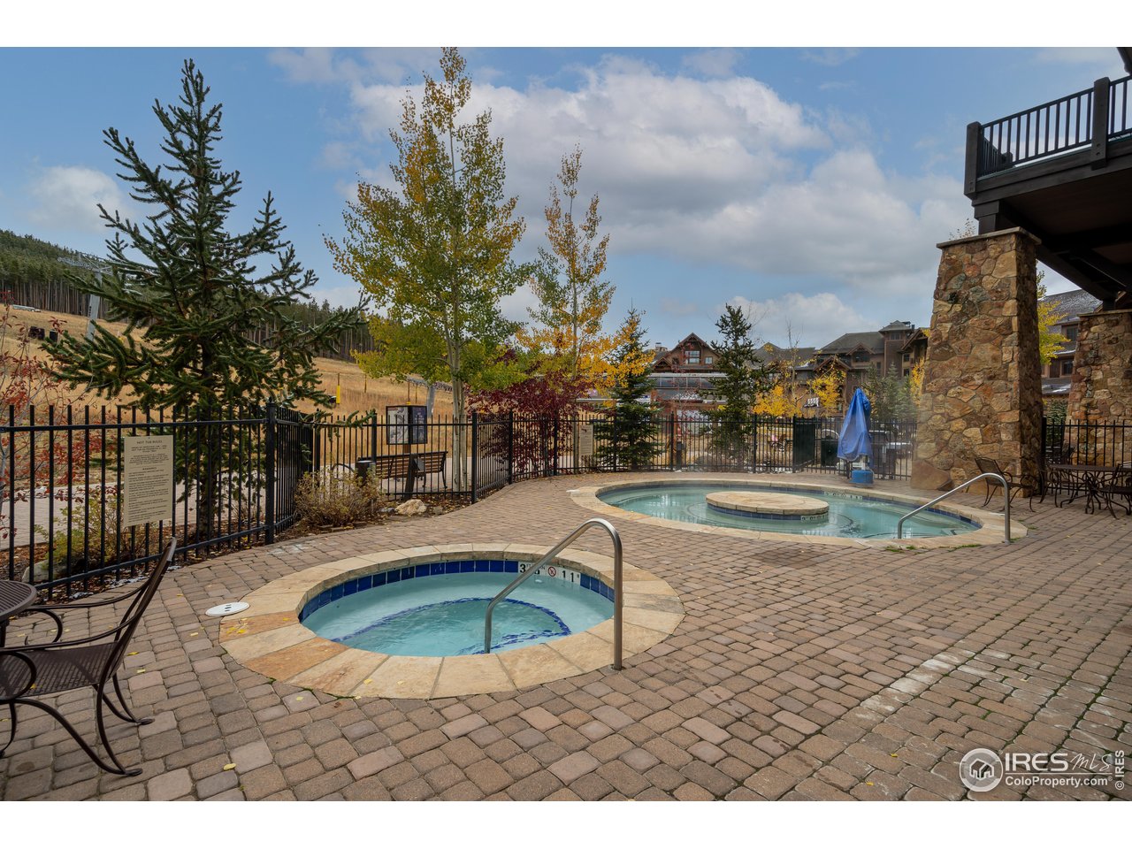 1891 Ski Hill Road, Unit 7408 Breckenridge, CO 80424 - Photo 25 of 30 a view of a swimming pool with a yard