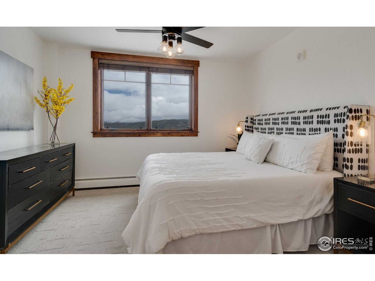 1891 Ski Hill Road, Unit 7408 Breckenridge, CO 80424 - Photo 9 of 30 a bedroom with a bed and window