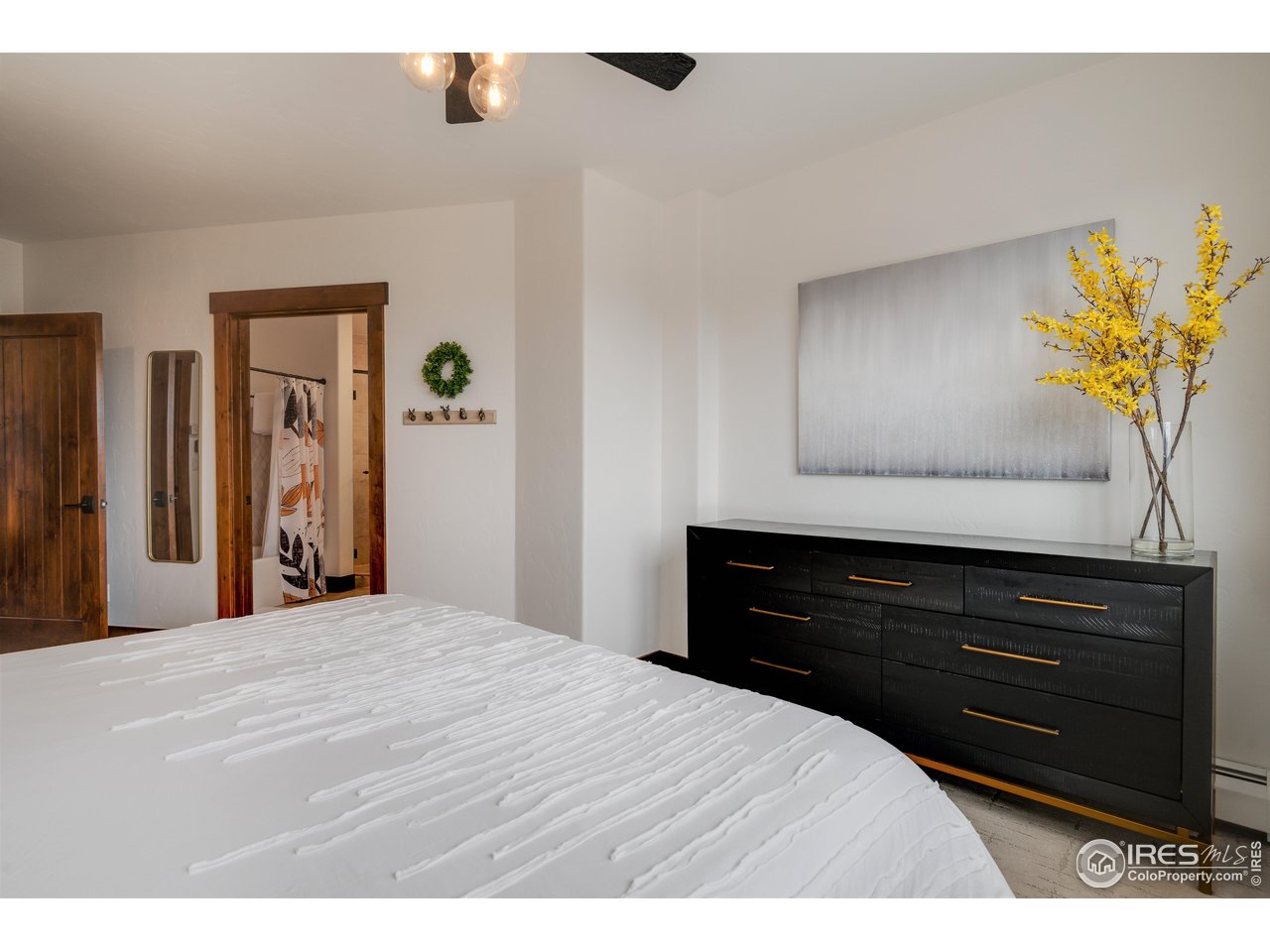 1891 Ski Hill Road, Unit 7408 Breckenridge, CO 80424 - Photo 10 of 30 a bedroom with a bed and a dresser