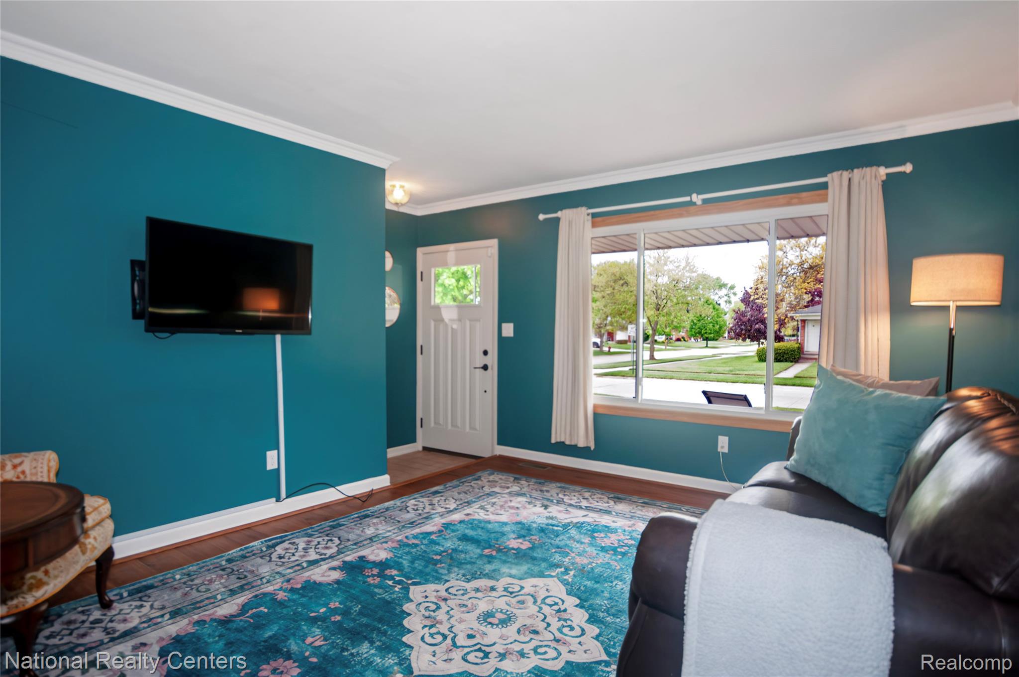 2446 Milverton Road Troy, MI 48083 - Photo 5 of 41 Living room with dark wood finished floors and crown molding