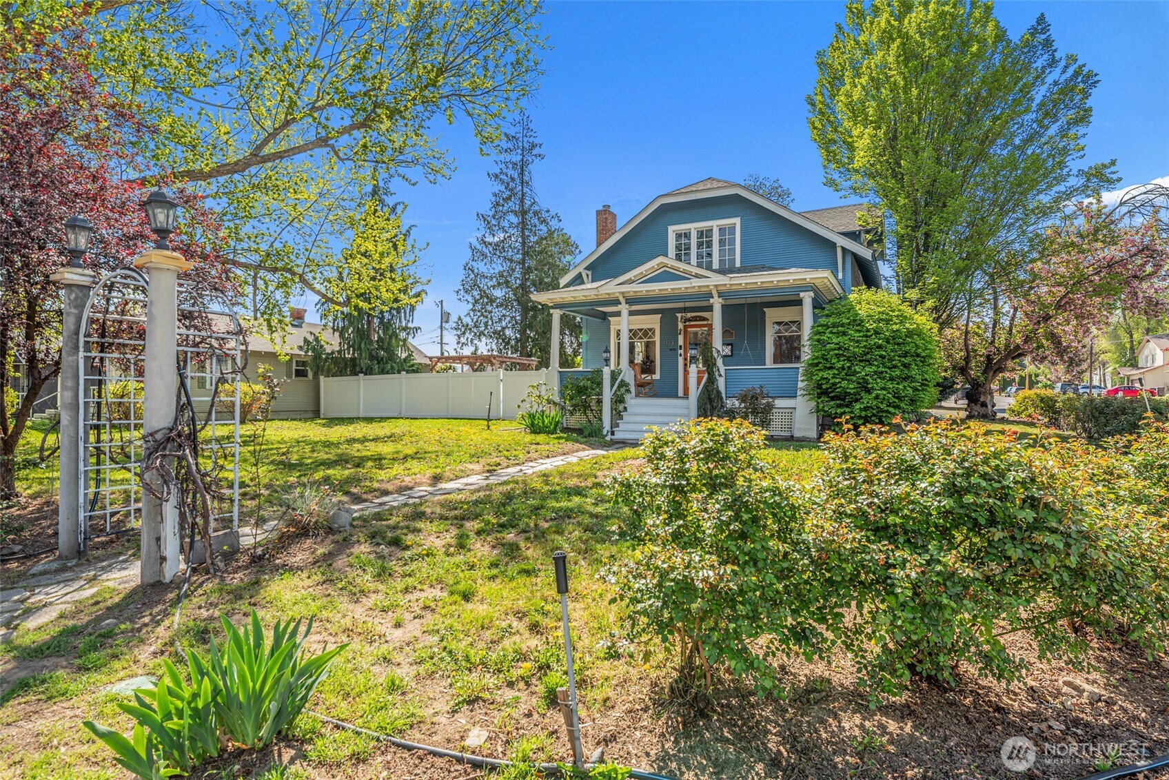 1133 Washington Street Wenatchee, WA 98801 - Photo 2 of 40 a front view of a house with garden