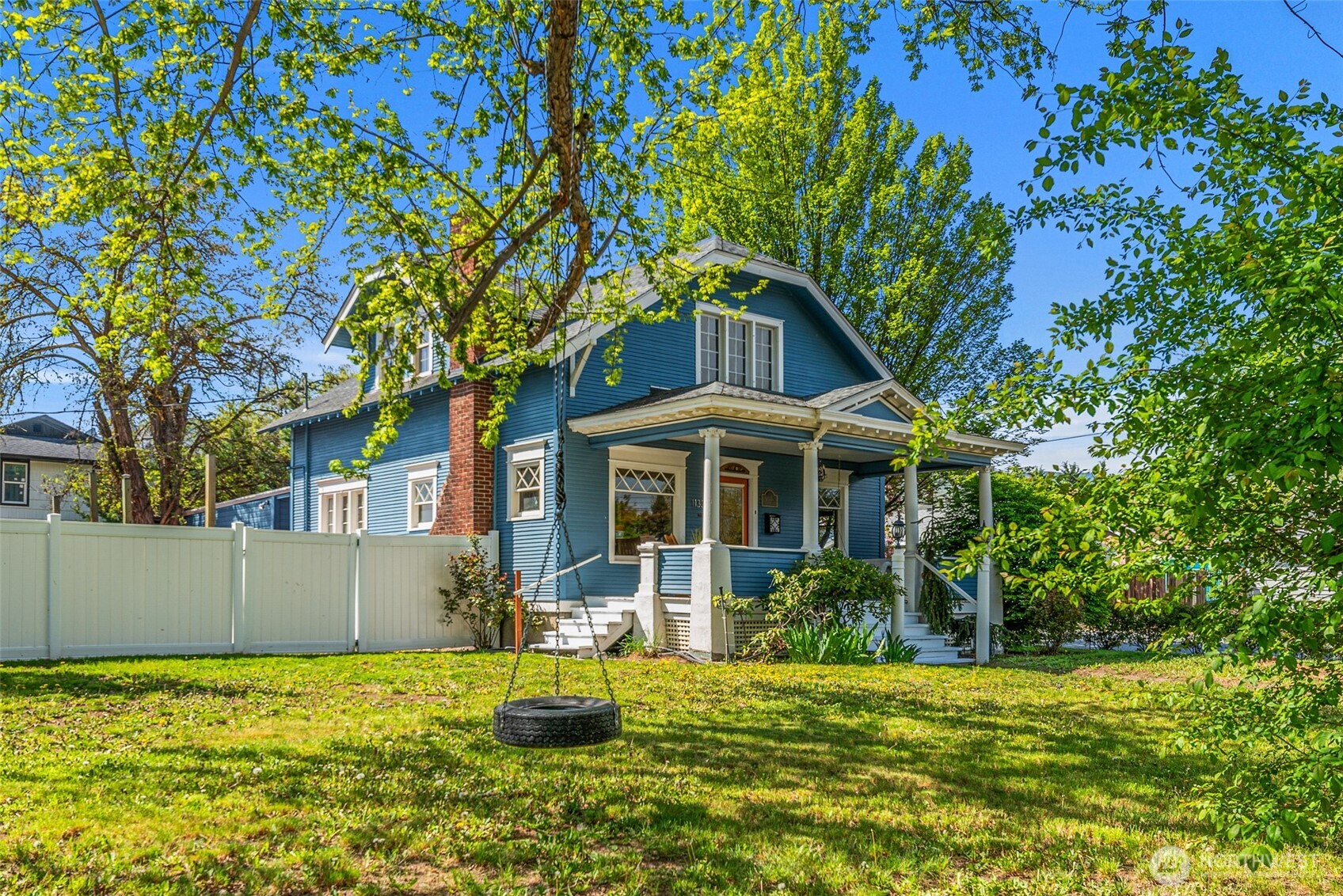 1133 Washington Street Wenatchee, WA 98801 - Photo 3 of 40 a front view of a house with a yard
