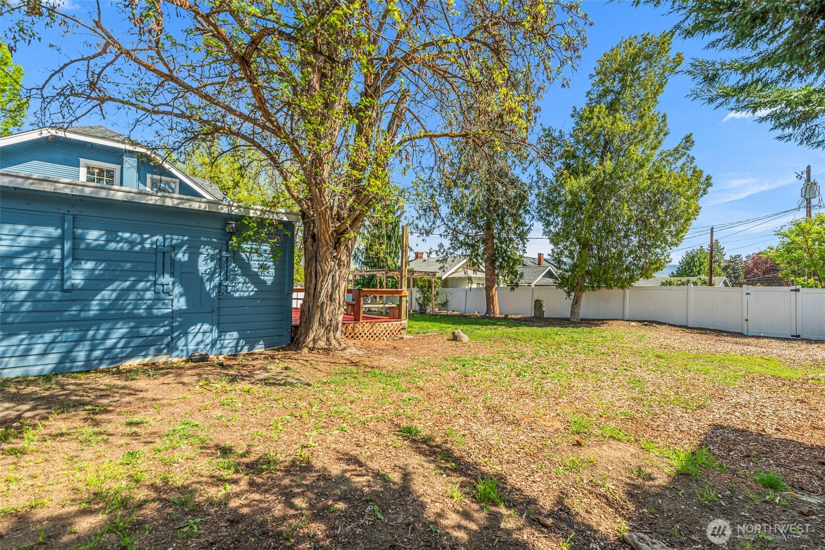 1133 Washington Street Wenatchee, WA 98801 - Photo 40 of 40 a house with trees in front of it