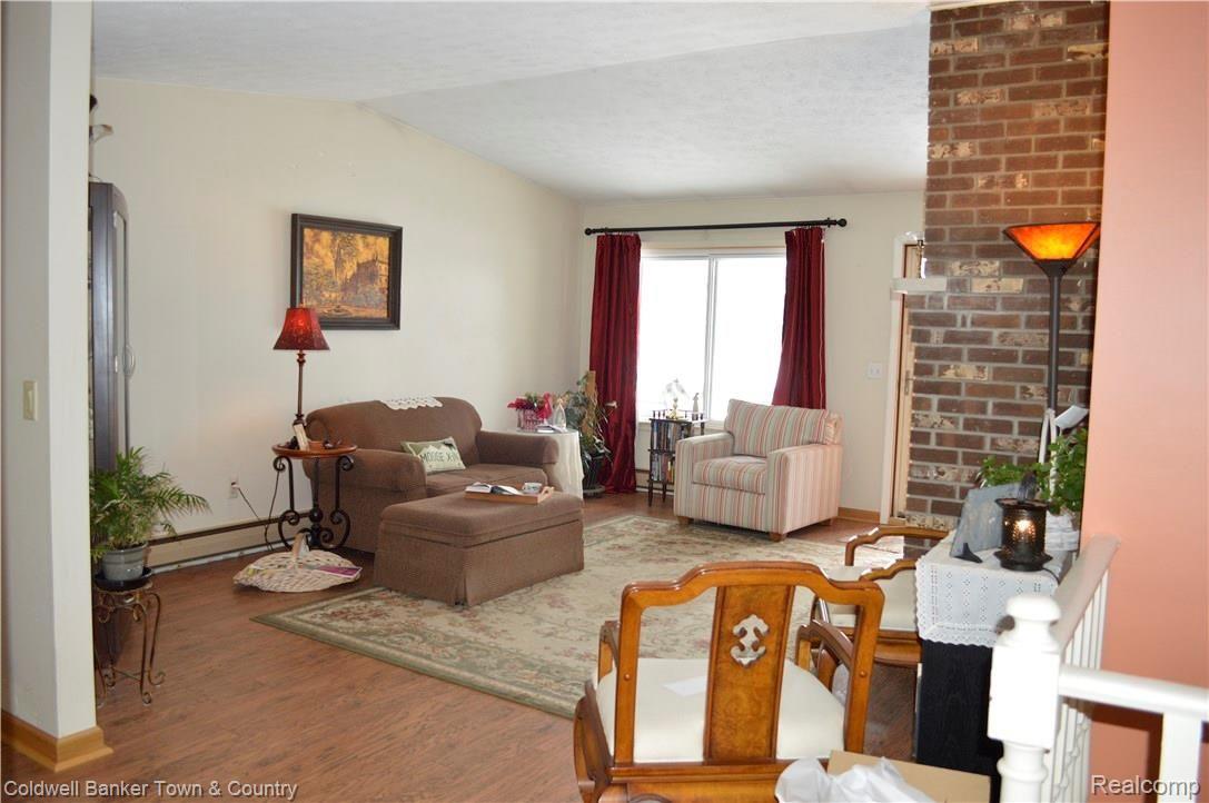 9797 Van Buren Road Fowlerville, MI 48836 - Photo 12 of 56 VIEW OF LIVING ROOM FROM DINING AREA.