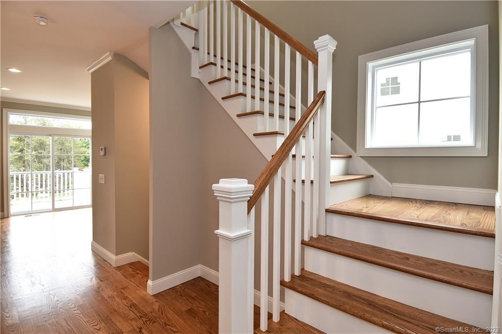 46 Village Crossing, Unit 46 Niantic, CT 06357 - Photo 11 of 24 a view of entryway and hall with wooden floor