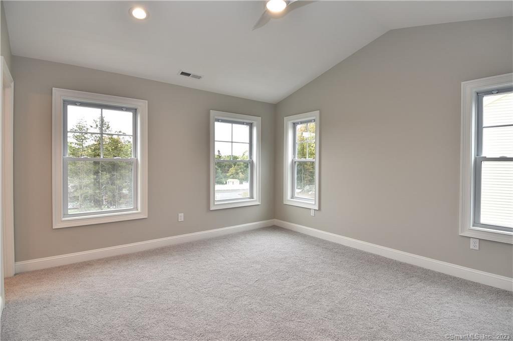 46 Village Crossing, Unit 46 Niantic, CT 06357 - Photo 13 of 24 an empty room with windows