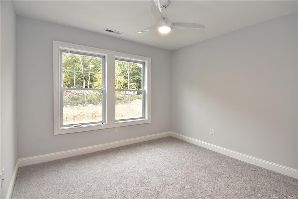 46 Village Crossing, Unit 46 Niantic, CT 06357 - Photo 21 of 24 an empty room with a window