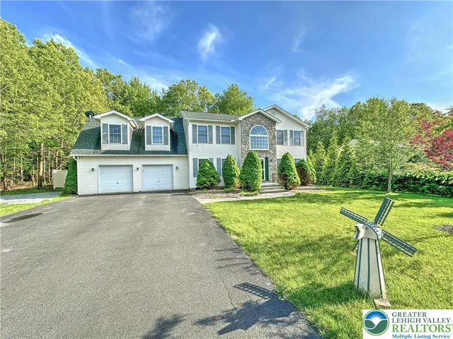 a front view of a house with yard