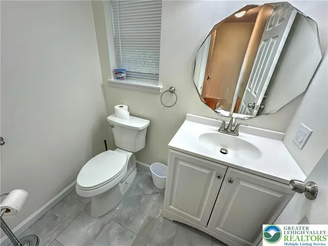 a view of a deck with chair and wooden fence