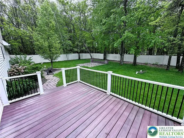 a view of a backyard with large trees
