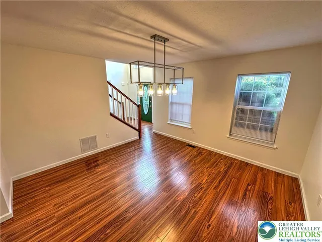 a view of entryway with wooden floor