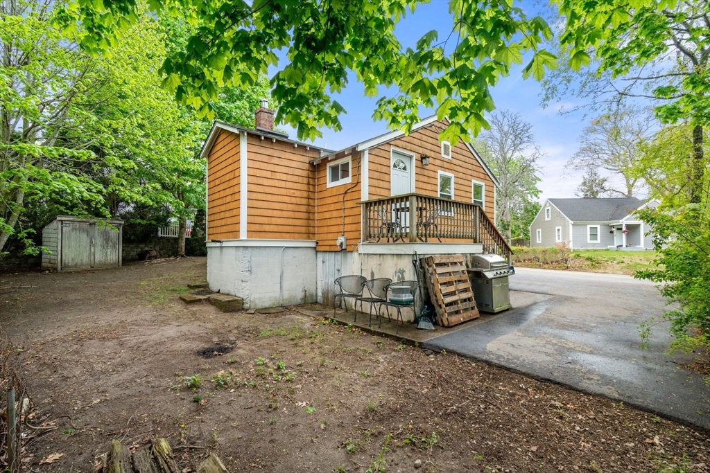 7 Indian Neck Road Wareham, MA 02571 - Photo 32 of 34 a view of a house with a yard and large trees