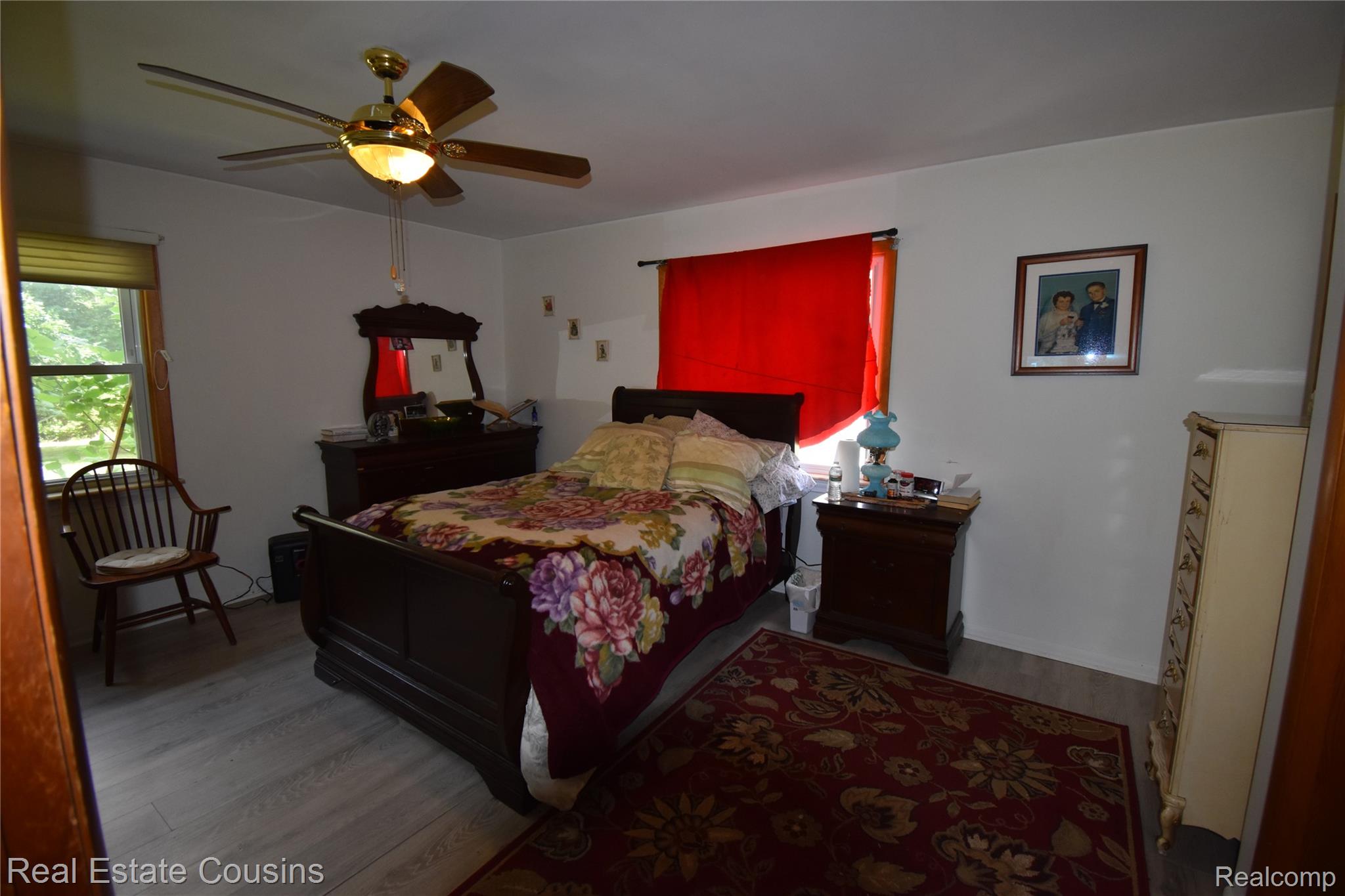 2247 Johnson Mill Road North Branch, MI 48461 - Photo 11 of 22 Room featuring wood-finish flooring, a ceiling fan with integrated lighting, and white wall finishes