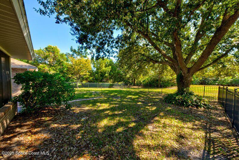 4116 Sparrow Hawk Road Melbourne, FL 32934 - Photo 40 of 70 Fenced Area of Back Yard View 3