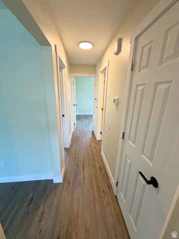 450 13800 South, Unit 2 Draper, UT 84020 - Photo 13 of 21 Hallway with wood-finish flooring extending throughout