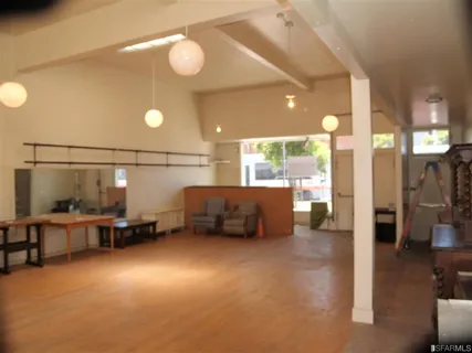 a view of a livingroom with furniture and windows