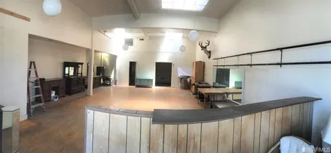 a kitchen with stainless steel appliances granite countertop a sink and a refrigerator