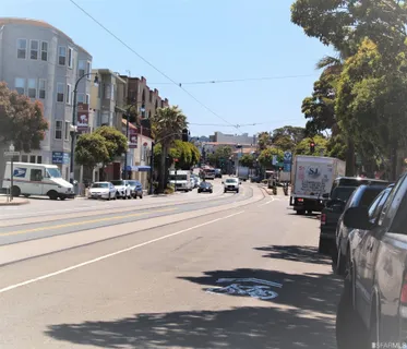 a view of a street with cars