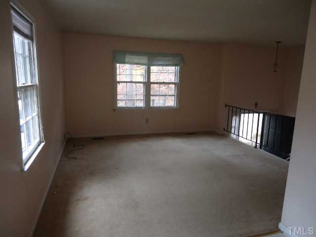 7628 Mine Valley Road Raleigh, NC 27615 - Photo 3 of 8 an empty room with a window