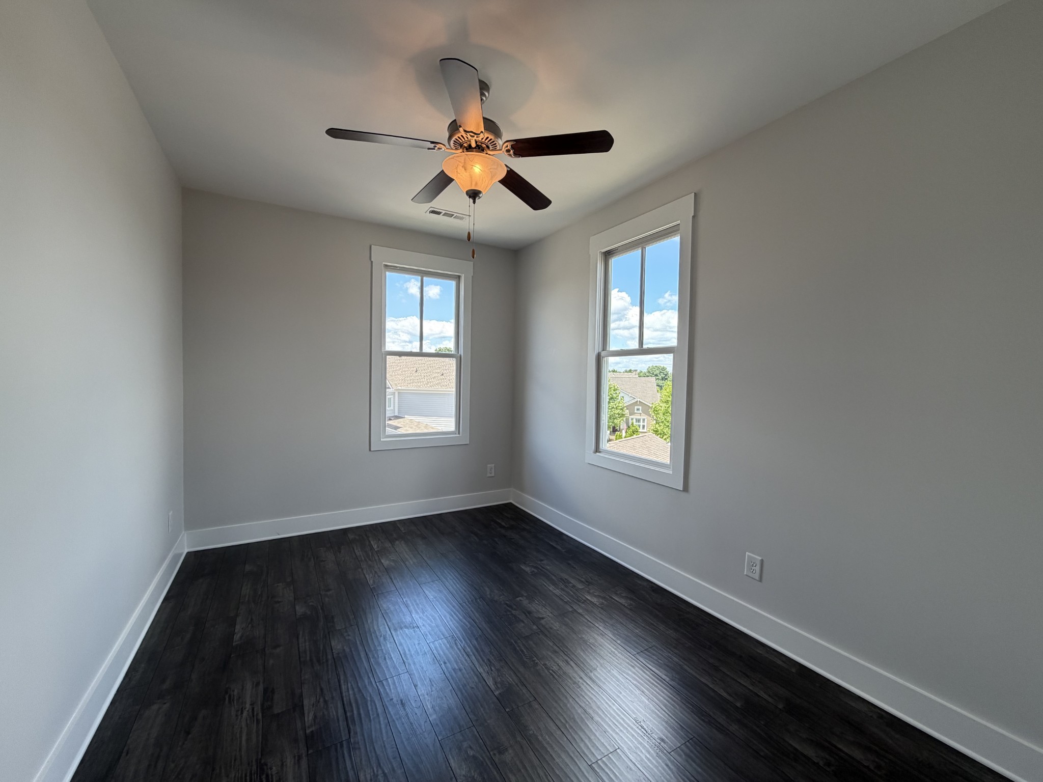 3097 Rural Plains Circle Franklin, TN 37064 - Photo 21 of 28 a view of an empty room with wooden floor and a window