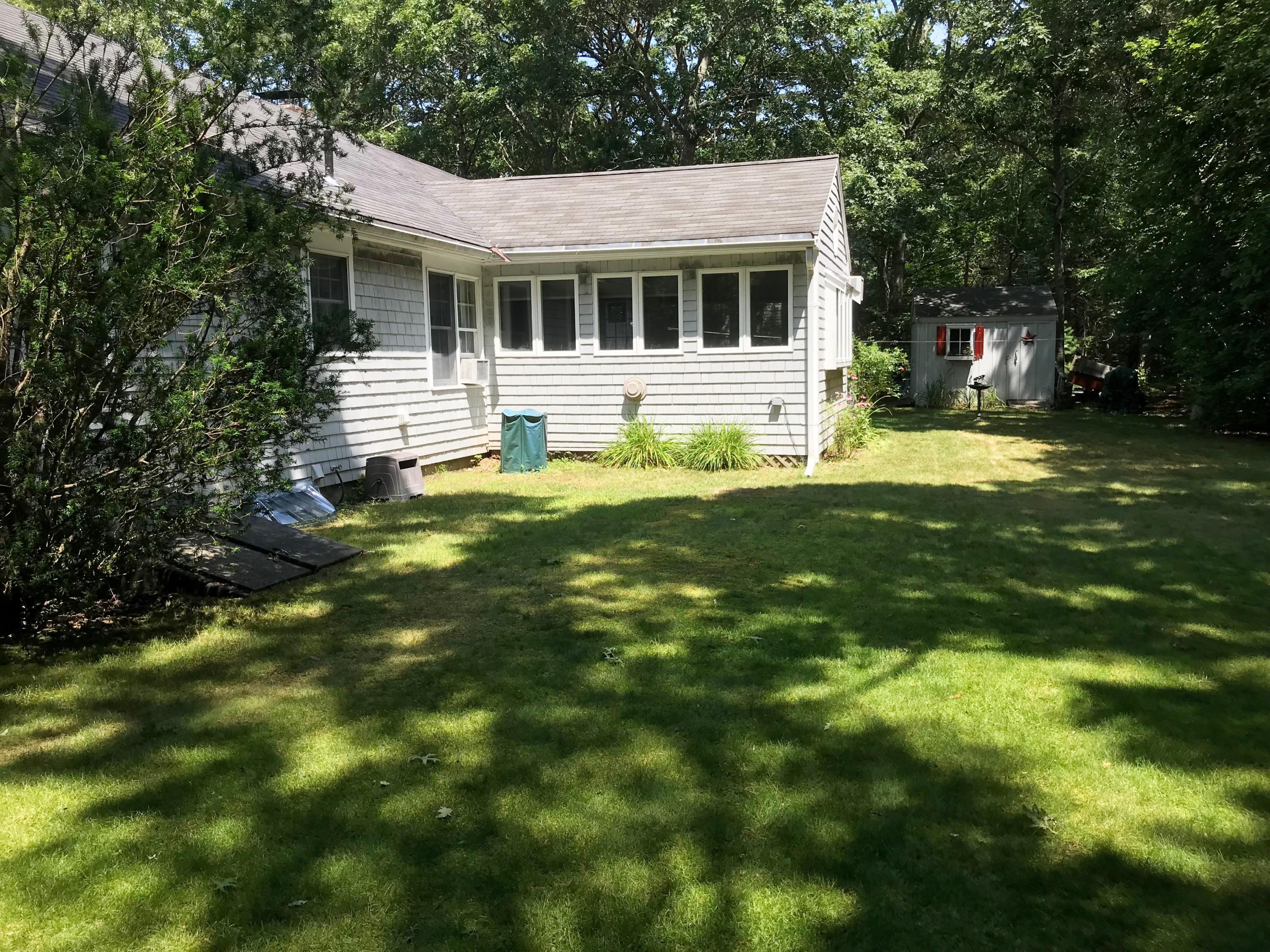 69 Camelback Road Marstons Mills, MA 02648 - Photo 3 of 16 a front view of house with yard and green space
