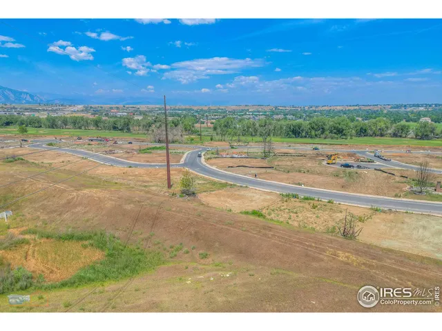a view of a field with an ocean