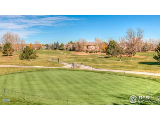 a swimming pool with outdoor seating and yard