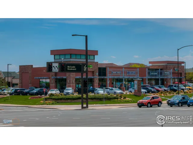 a view of a swimming pool with a table and chairs