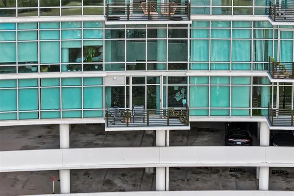 a view of a patio with table and chairs potted plants with wooden fence
