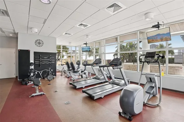 a view of a swimming pool with outdoor seating