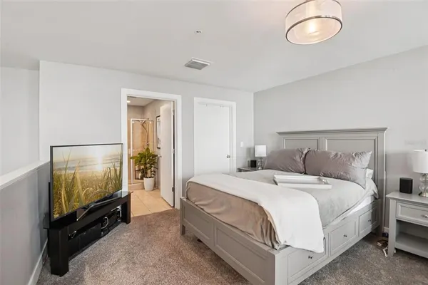 a spacious bathroom with a granite countertop sink toilet and shower