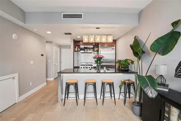 a kitchen with a stove and a refrigerator