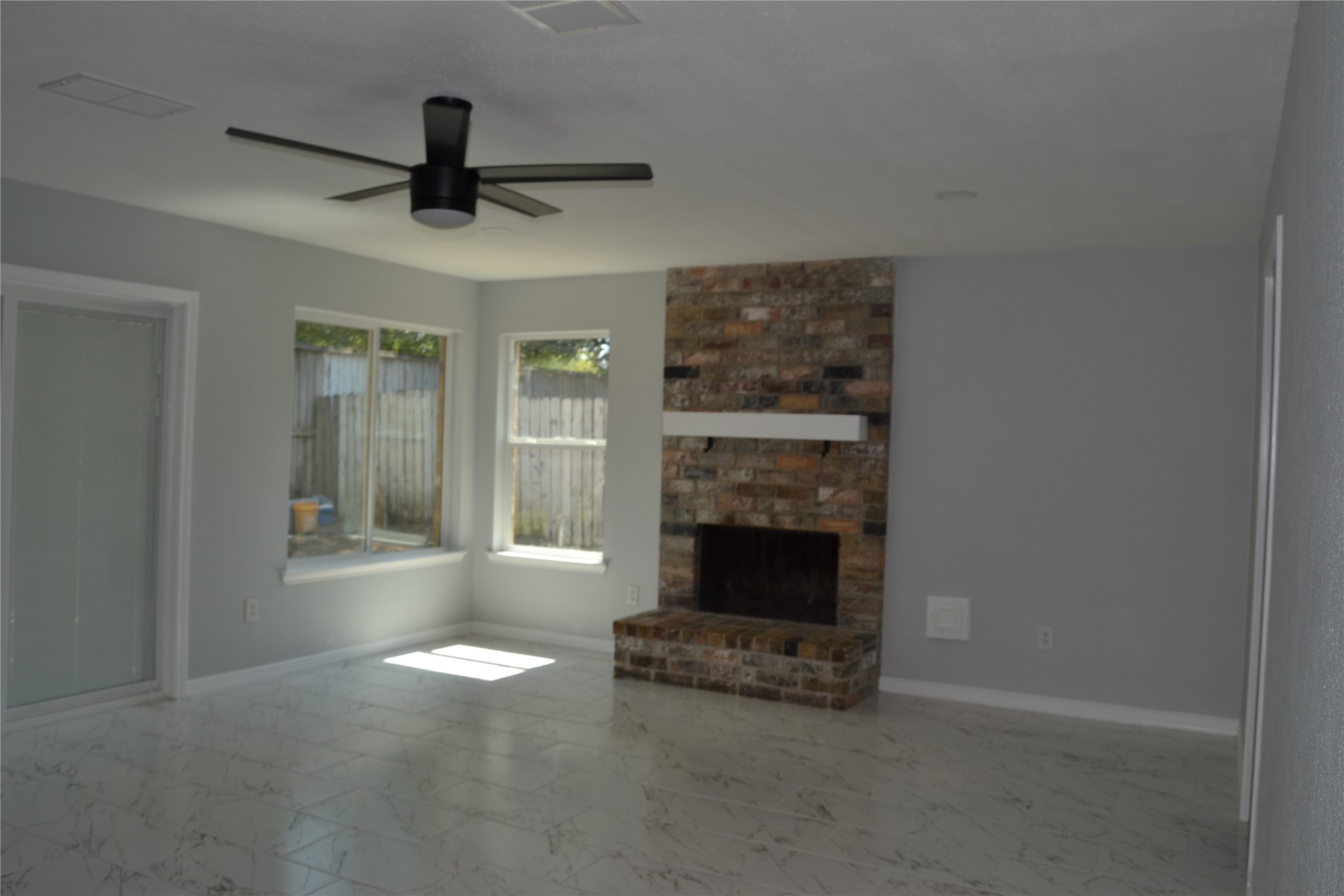 2242 Gray Hawk Lane Katy, TX 77449 - Photo 20 of 32 a living room with furniture and a fireplace