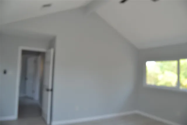 a bathroom with a sink a toilet and a window