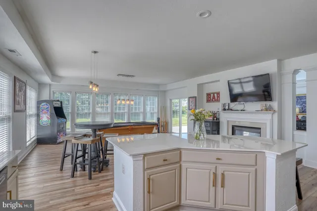 a kitchen with stainless steel appliances granite countertop a stove and cabinets