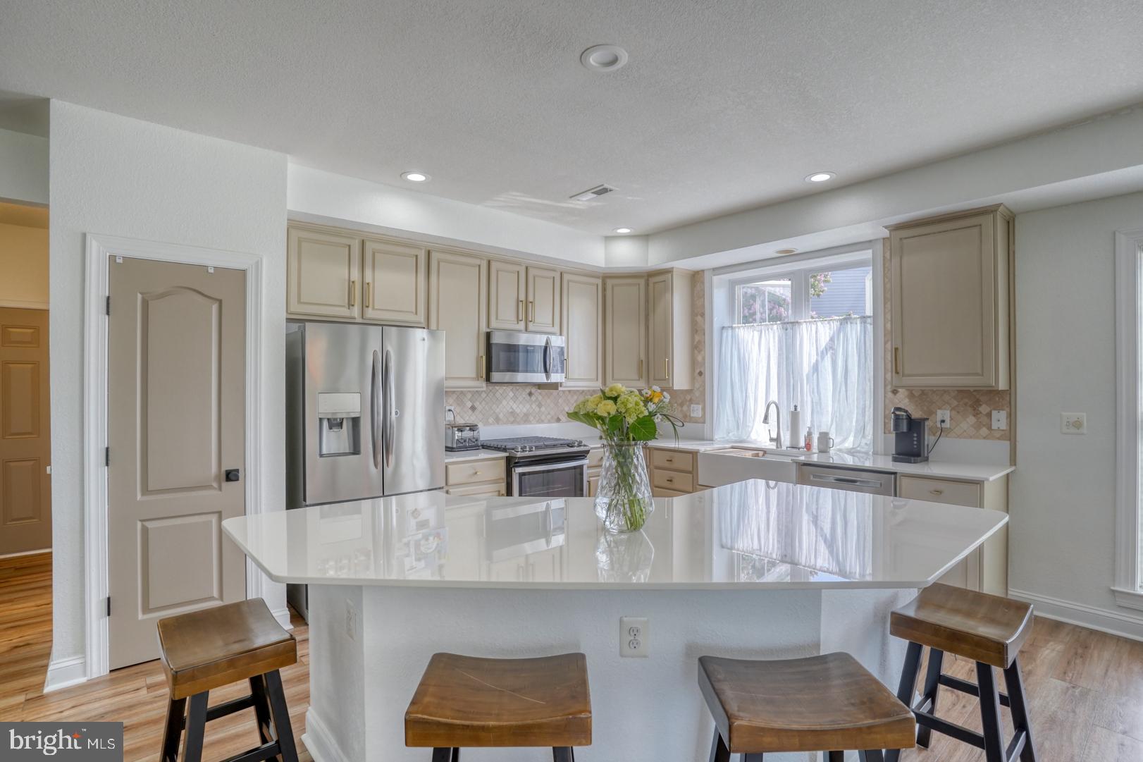 34026 Joyce Court Lewes, DE 19958 - Photo 18 of 48 a kitchen with stainless steel appliances granite countertop counter space and a refrigerator
