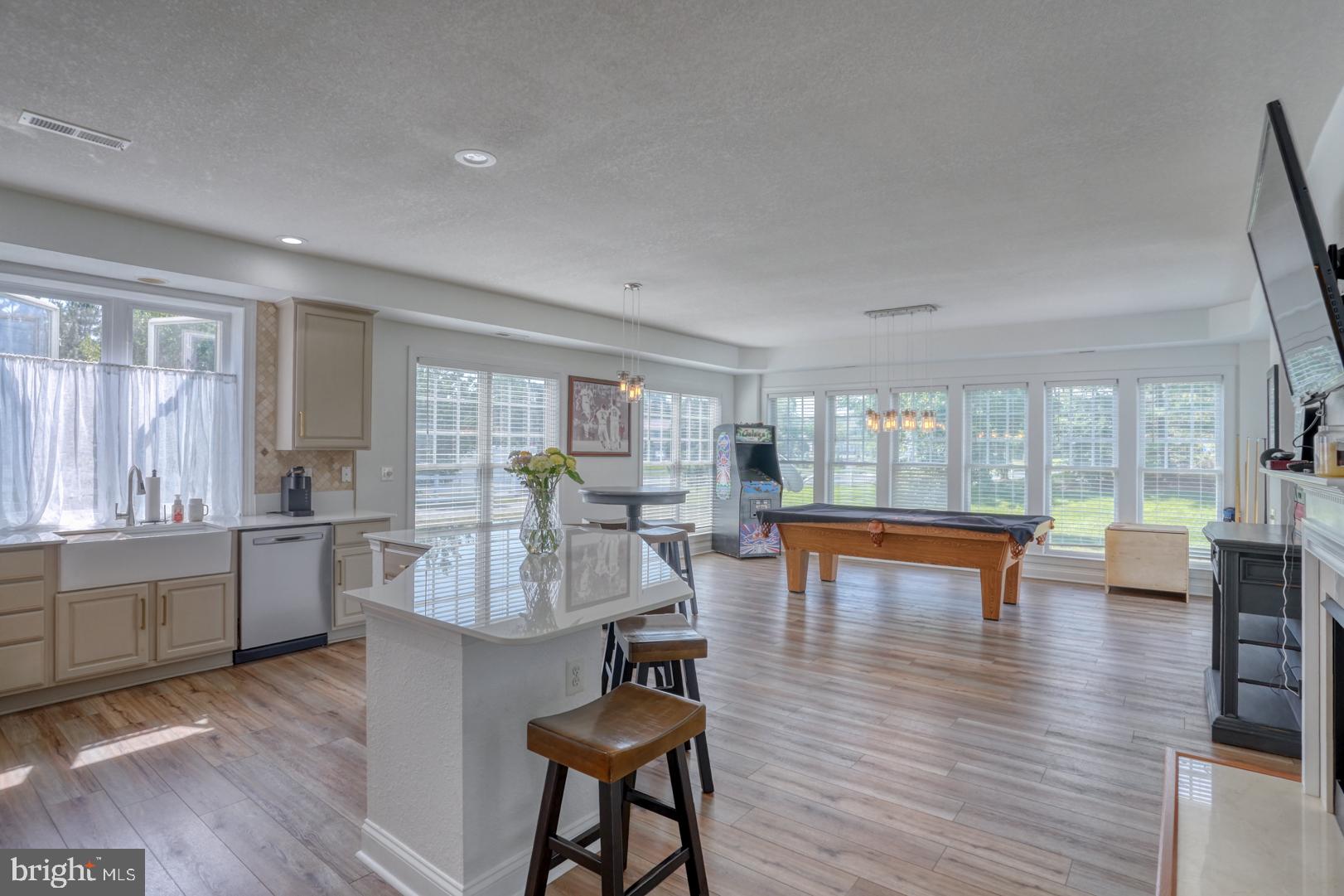 34026 Joyce Court Lewes, DE 19958 - Photo 19 of 48 a living room with fireplace furniture and a wooden floor