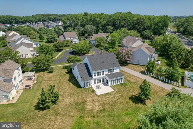 an aerial view of a house with swimming pool garden and mountain view