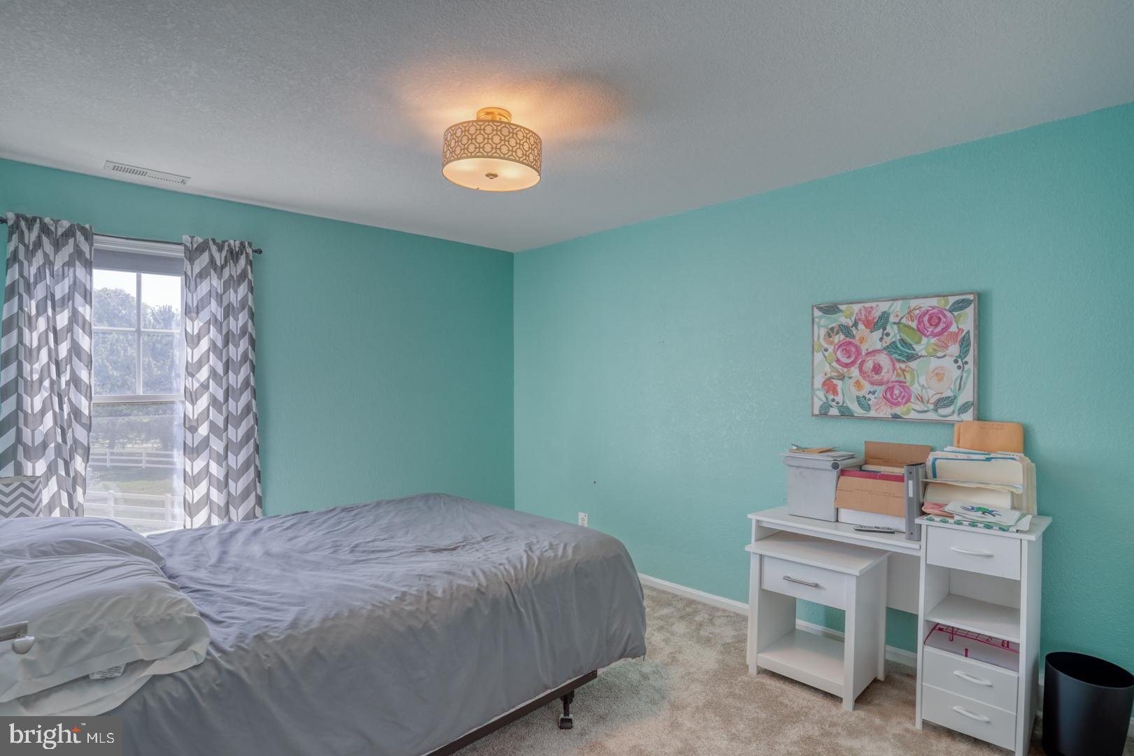 34026 Joyce Court Lewes, DE 19958 - Photo 34 of 48 a bedroom with a bed and a window