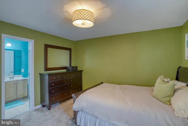 a bedroom with a bed and a television