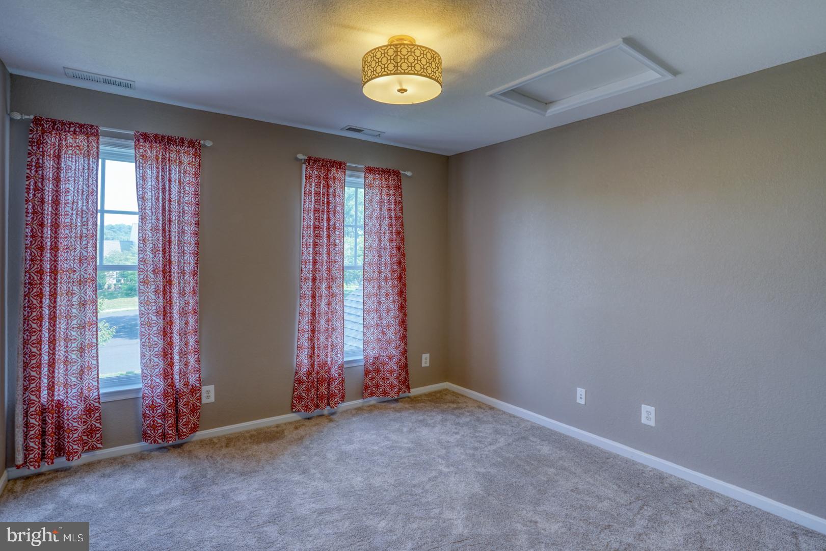 34026 Joyce Court Lewes, DE 19958 - Photo 38 of 48 an empty room with windows and closet