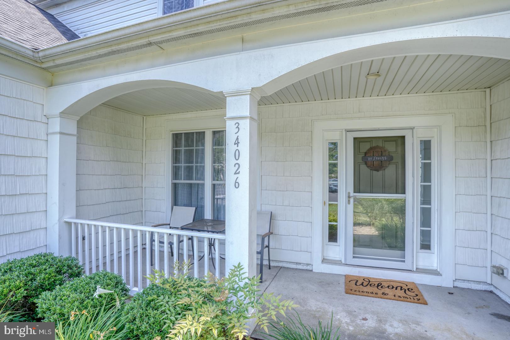 34026 Joyce Court Lewes, DE 19958 - Photo 4 of 48 a front view of a house with a garage
